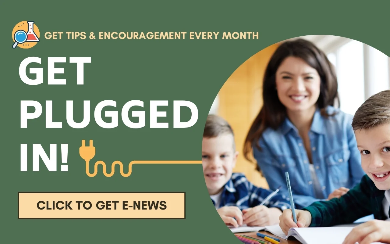 A cheerful homeschool mom is helping two young boys with their schoolwork at a table. The text reads: "Get tips and encouragement every month. Get plugged in! Click to get e-news." The image includes an electrical plug graphic.